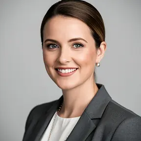 Professional female client headshot, modern business outfit, confident smile, clean neutral background, balanced lighting, corporate portrait photography, high resolution
